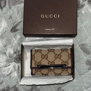 Gucci Beige and Brown Key  Holder new with plastic on metal opening!!
